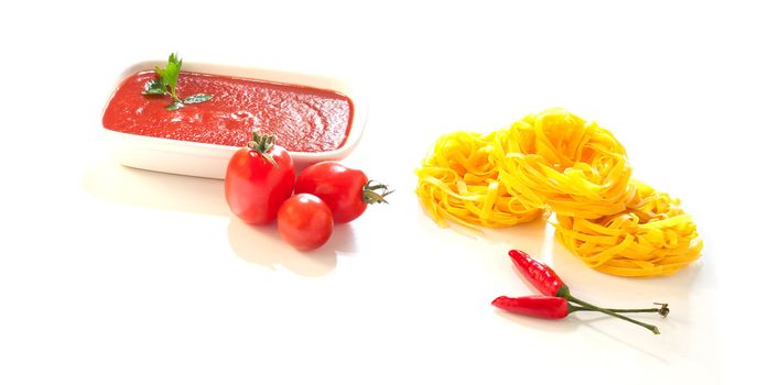 Tomatoes, tagliatelle, chili peppers and tomatoes sauce, Ingredients for italian pasta on white background