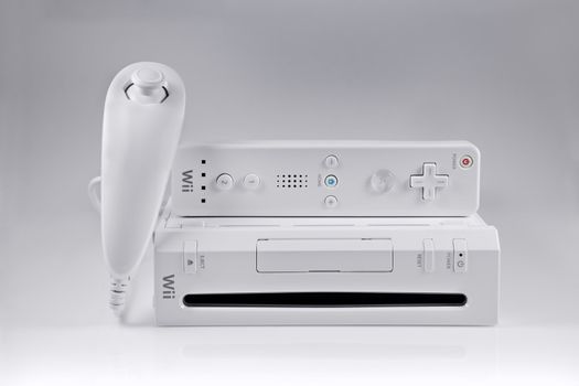 A studio shot of the Nintendo Wii video game system with the nunchuk and controller set.