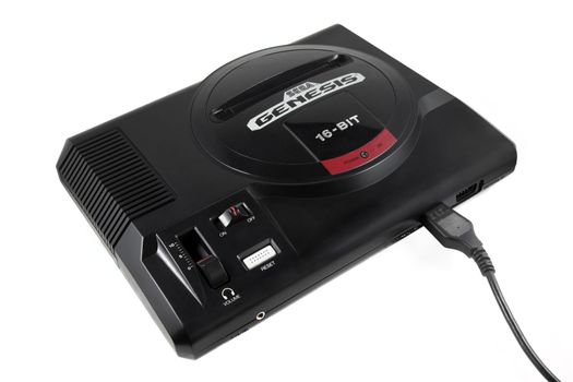 A studio shot of the Sega Genesis video game system shot of a solid white background.