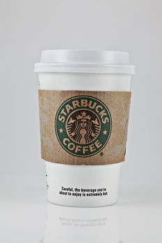 A studio shot of a cup of Starbucks Coffee.