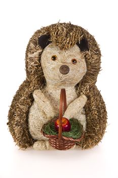 Hand made hedgehog with aplle in the basket - isolated