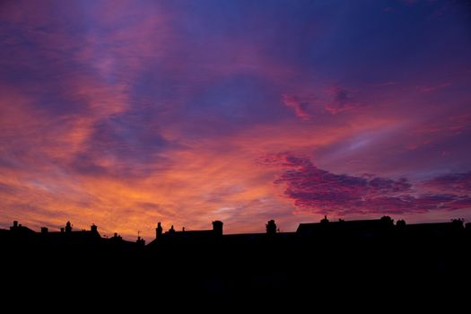 Beautiful sunrise over the village buildings