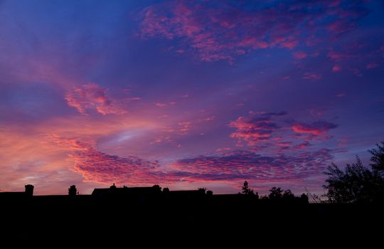 Beautiful sunrise over the village buildings