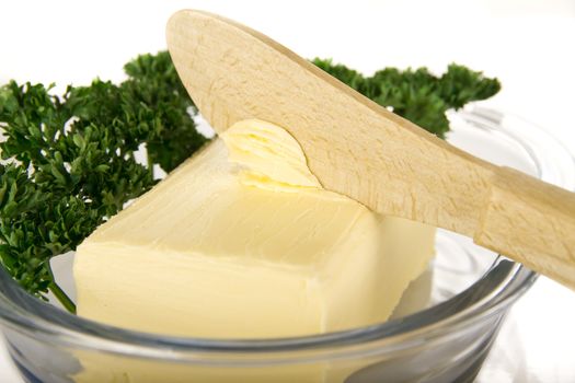 Butter with knife on the plate - isolated