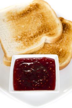 Toasts with jam over white background