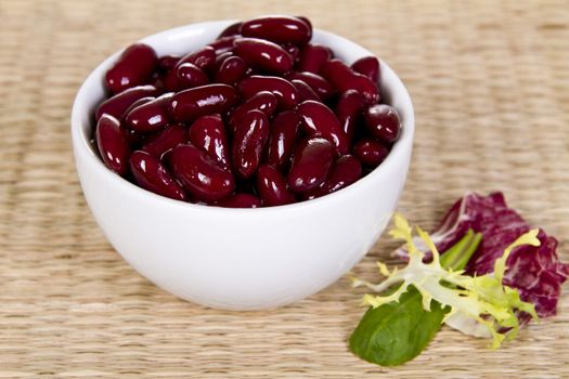 Kidney Beans in the bowl with fresh salad leaves