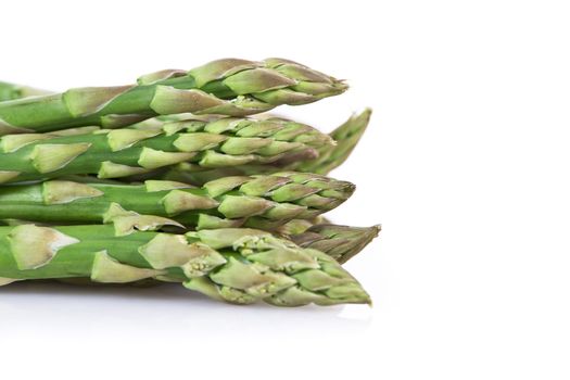 Fresh asparagus isolated over white