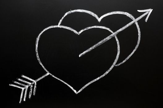 Hearts with Cupid's arrow hitting through, drawn in chalk