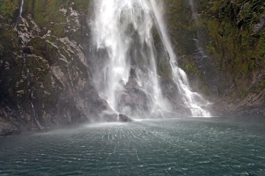 splashing of milford sound waterfall New Zealand