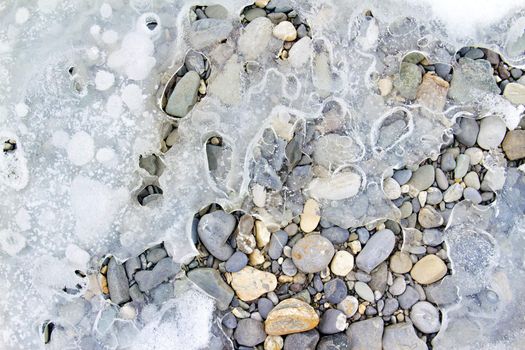 colored stones and ice in the background