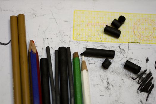 Crayons and pencils on mail paper