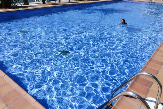 Young woman in the swimming pool