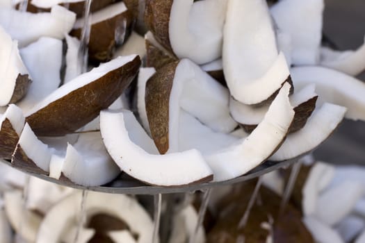 Sliced coconut inside a fountain
