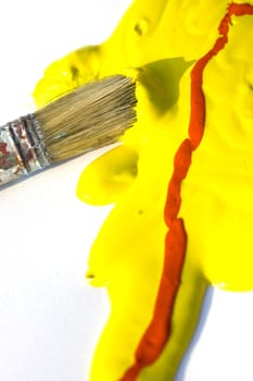 Photo of Yellow and red colors and paintbrush