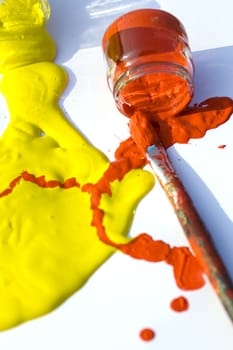 Photo of Yellow and red colors and paintbrush