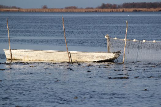 fishpond with boat and driftnet