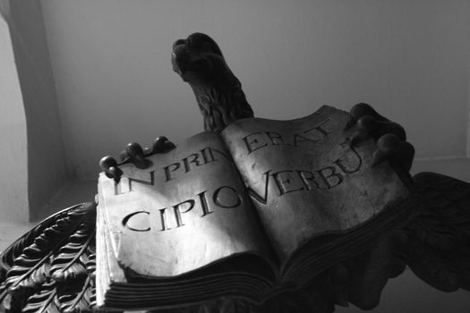 The Sentence "In principio erat Verbum" on a statue