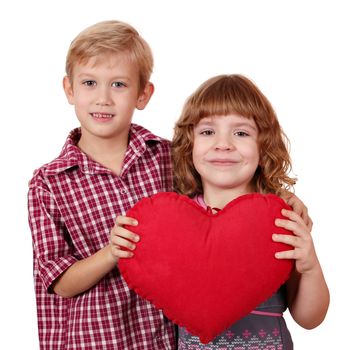 little girl and boy posing with red heart