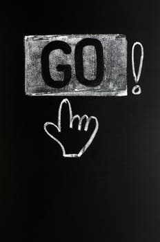 Go button with a hand drawn in chalk on blackboard
