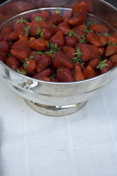 Fresh strawberry inside a silver bowls