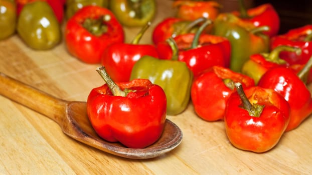 Red hot chili peppers on cutting board