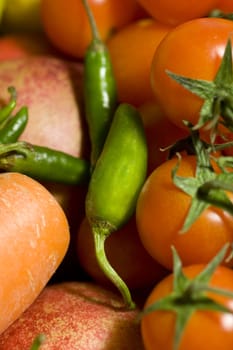 Close up of Little tomatoes and green peppers