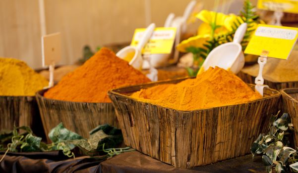 Turmeric on wooden basket in a street market