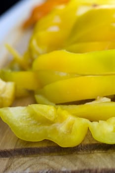 Yellow sliced pepper on a cutting board
