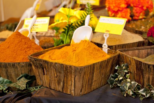Turmeric on wooden basket in a street market