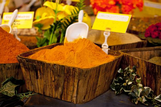 Turmeric on wooden basket in a street market