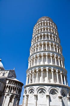 Italy - Pisa. The famous leaning tower on a perfect blue bakcground