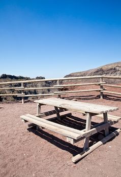 Empty bench in front of volcano Vesuvius crater. This bench is used during trekking