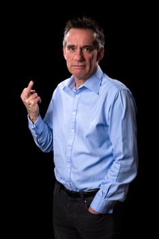 Angry Frowning Middle Age Business Man Giving One Finger Gesture on Black Background