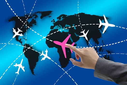 hand touch on planes with routes around the world for business travel concept