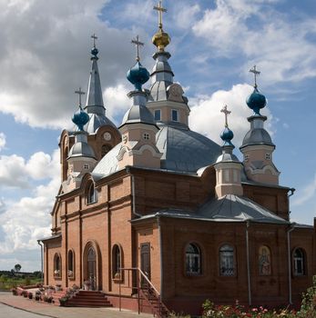 Rural church on a background of the blue sky