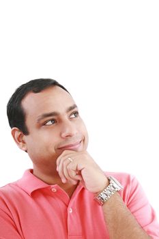 Portrait of a thoughtful young guy standing looking away on white background