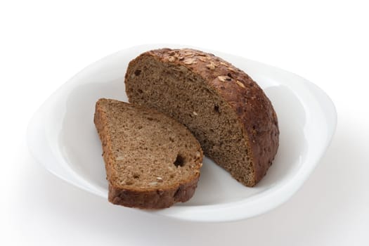 Rye bread on a plate on a white background