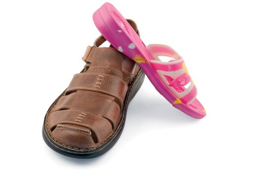 Man's and female sandals on a white background