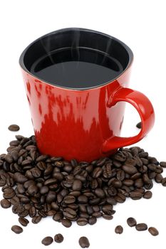 Handmade square red ceramic mug filled with hot black coffee with beans over white