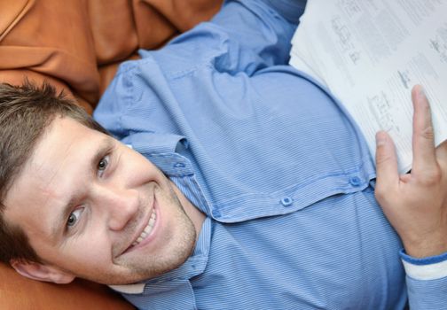 Professional young man smiling and looking at camera