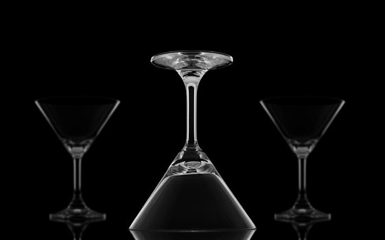 One Sharp upside down Cocktail glasses and Two Blur on black background and reflection