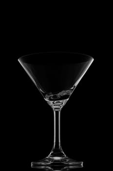 Cocktail glasses on black background and reflection