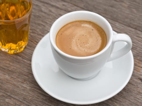 White ceramic Cup of coffee and glass of tea on Wood table