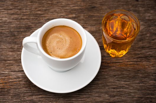 Top White ceramic Cup of coffee and glass of tea on Wood table