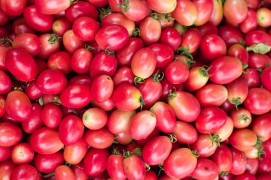 Tomatoes on the food market for background