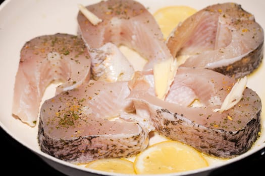 The fried fish on the frying pan