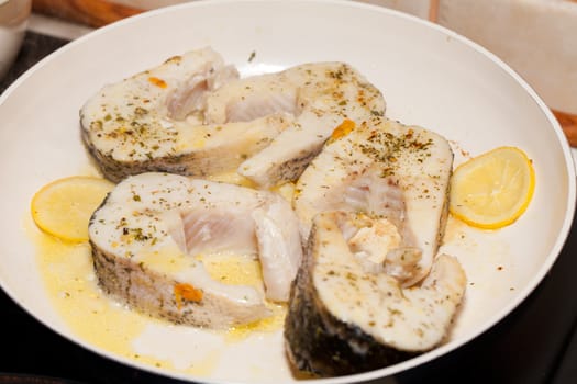 The fried fish on the frying pan
