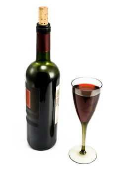 Glass and bottle with red wine