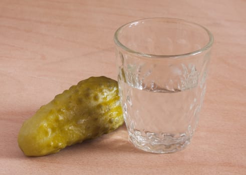 Cucumber and glasses of vodka