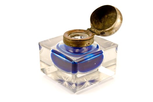 Antique inkwell with blue ink isolated on white